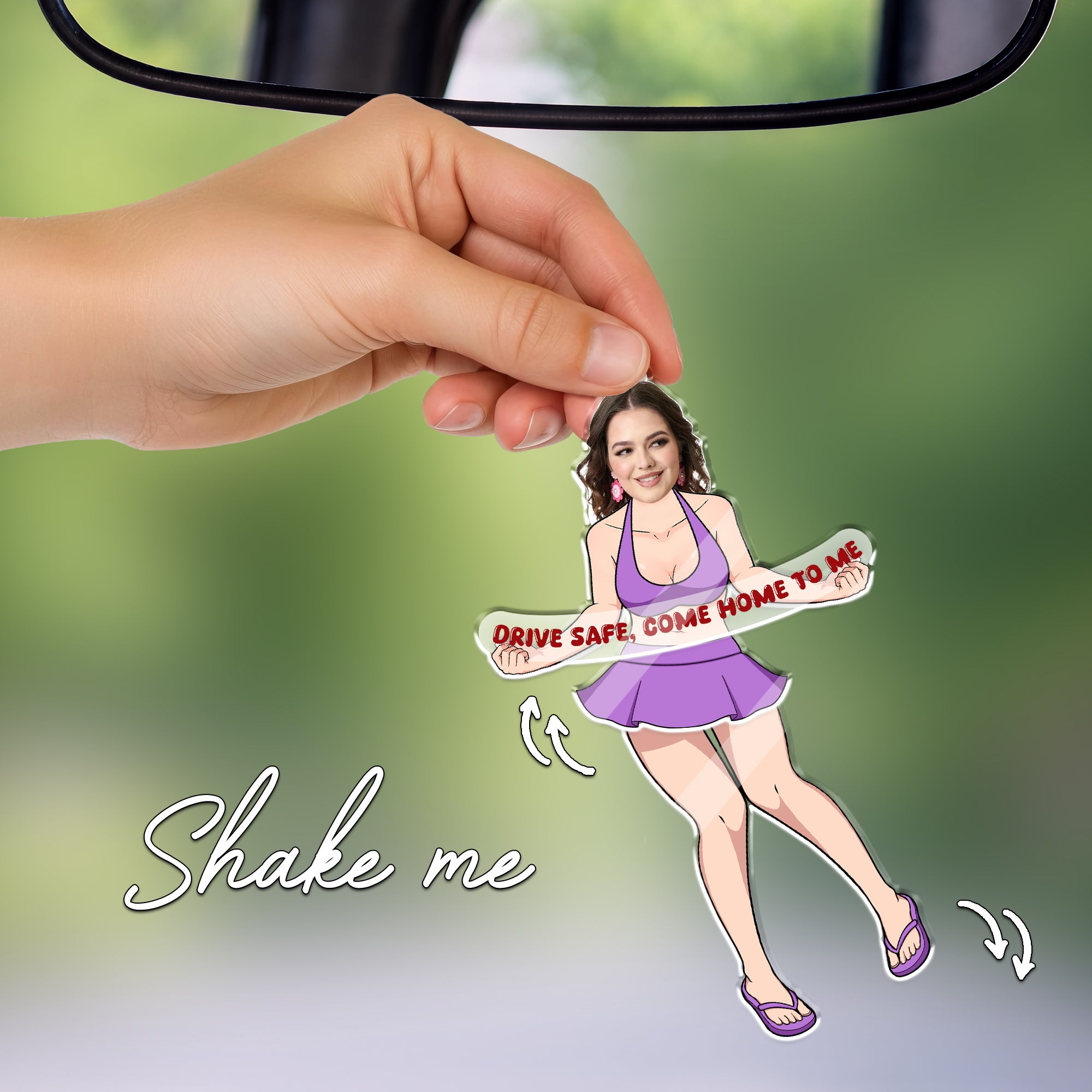 Hand holding personalized swaying car ornament with custom photo face, playful drive safe quote, funny romantic gift for boyfriend or husband.