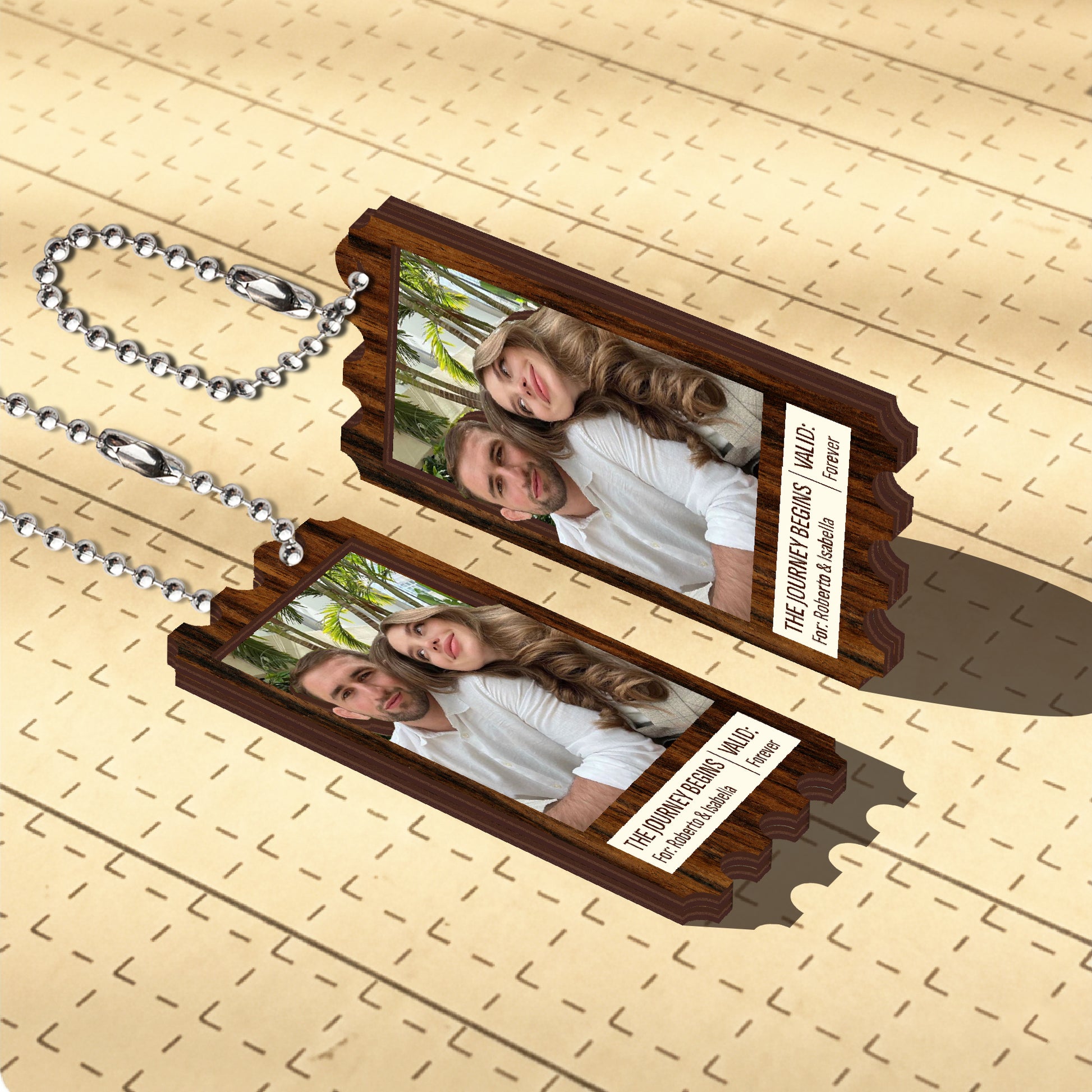 Custom double-layer wooden keychain with couple photo and engraved text, shown from an angled top view