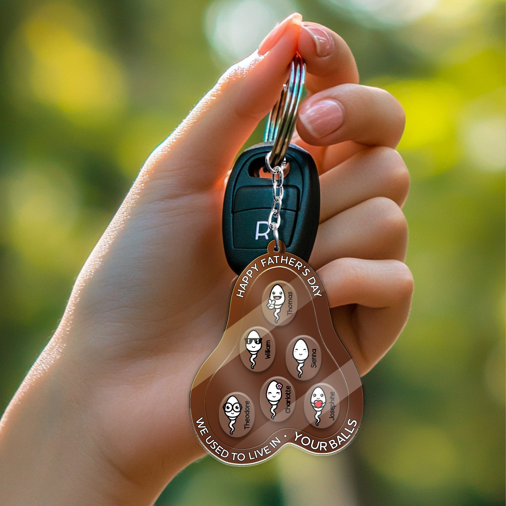Funny Father’s Day keychain attached to car keys, personalized acrylic shaker with multiple moving sperm characters inside